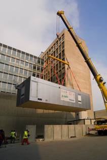 Lifting the container into position at the hospital