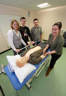 SimMan - From left: Dr Denise Taylor (Senior Teaching Fellow in Clinical Pharmacy) with students Gareth Kitson, Joe Tooley and Sophie McGlen. (credit: Nic Delves-Broughton)