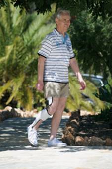 A user walking with the E-MAG knee
