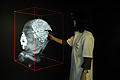 A doctor examines the MRI of a newborn with a malformation of development of the cerebral cortex and cerebellum in the I-space environment powered by SGI systems.
