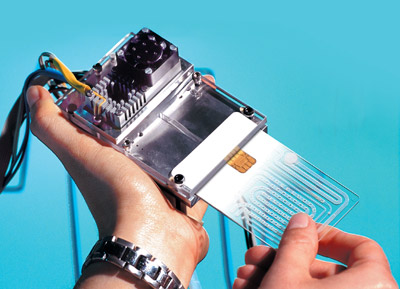 Siemens' lab on a chip, called quicklab, a miniature laboratory the size of a credit card. It can automatically extract from blood samples or other bodily fluids the genetic information of viruses, bacteria or body cells and analyze it.