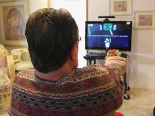  patient undergoing rehabilitation by playing the video game