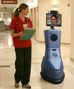 Doctor consulting a nurse via the robot