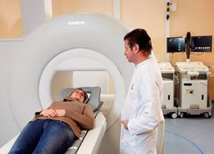A patient lies in the magnetic guidance system